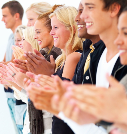 Group of young men and women clapping