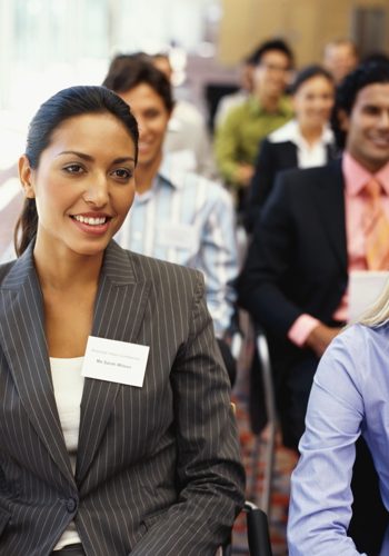 group of business executives sitting at a seminar